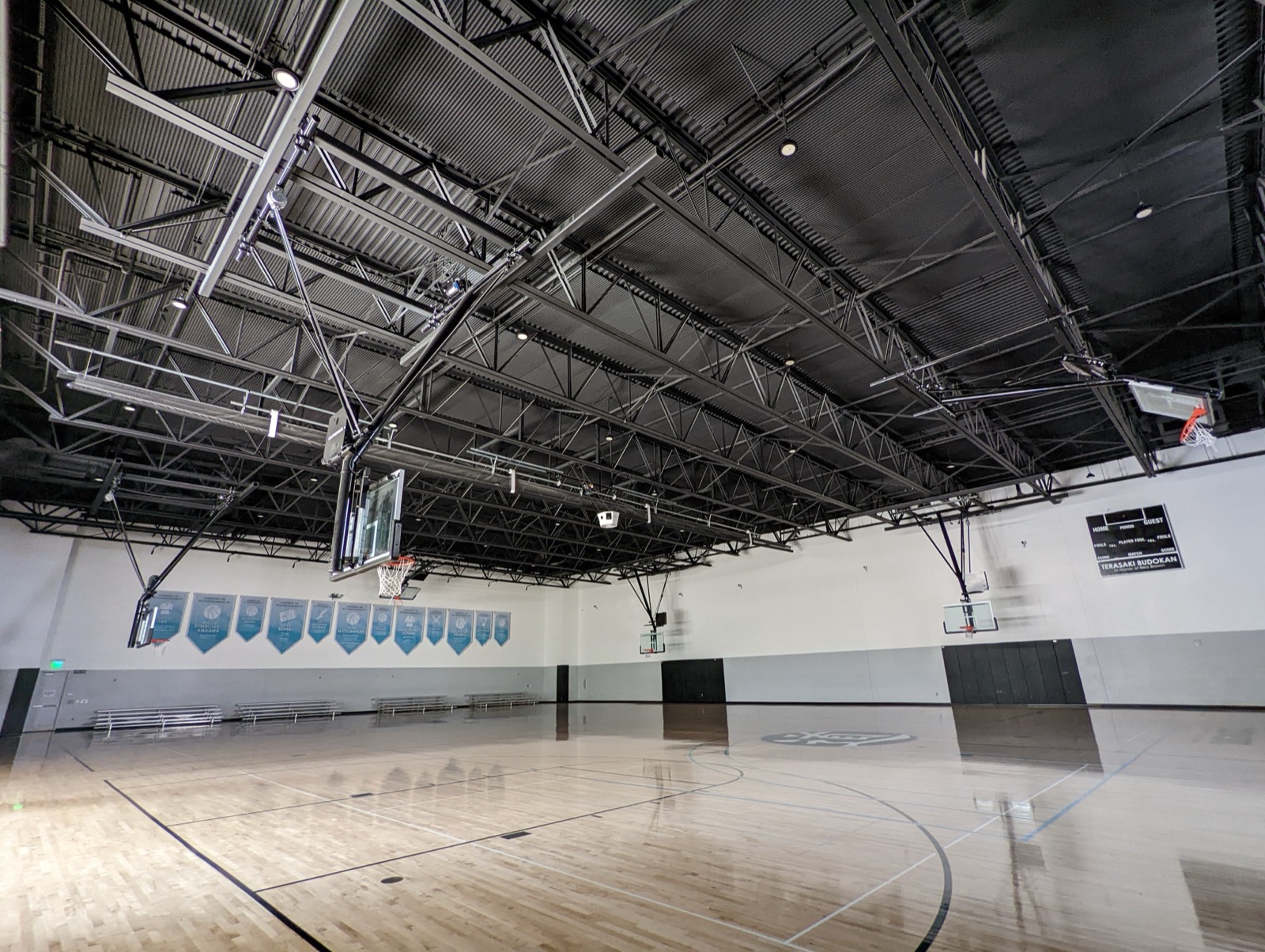 Terasaki Budokan gymnasium with CAFETERIA black recycled-PET acoustic panels installed across the ceiling